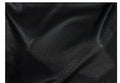 Black textured fabric with a fine dotted pattern and soft folds, shown close-up against a white border.