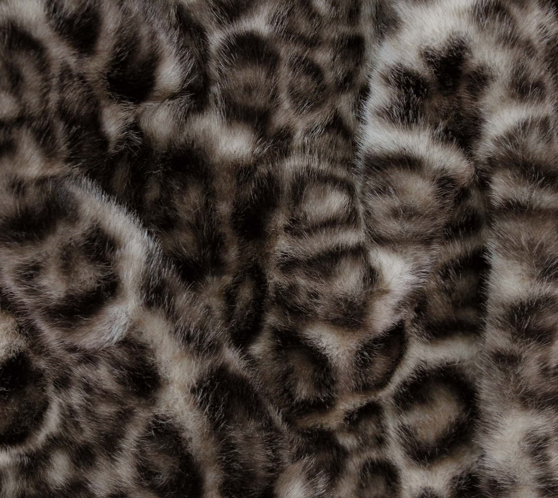 Leopard print faux fur fabric with a realistic textured pattern in black, brown, and beige.